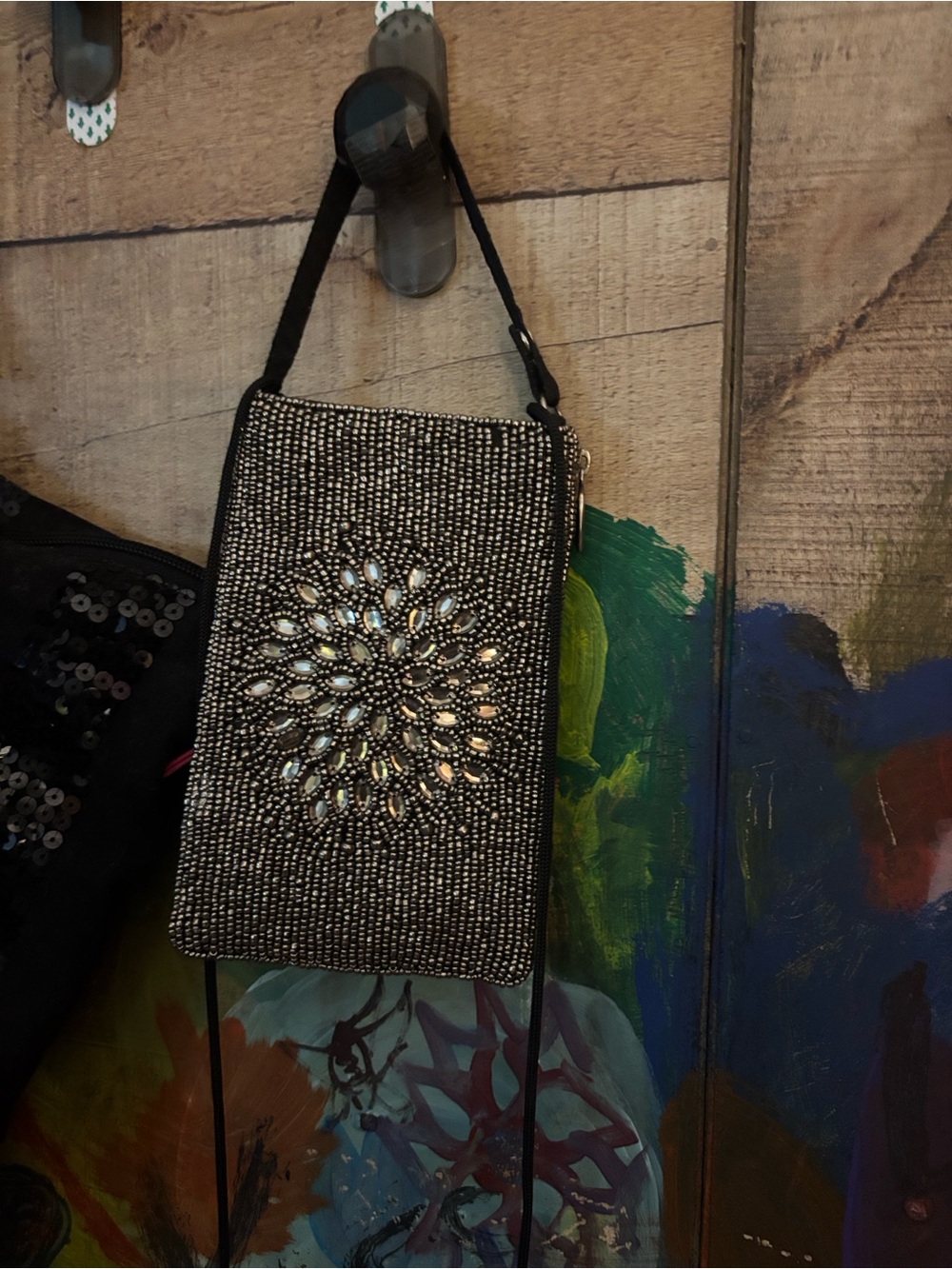 This is a Bamboo Trading Company "Night Bloom" beaded club bag in black.
